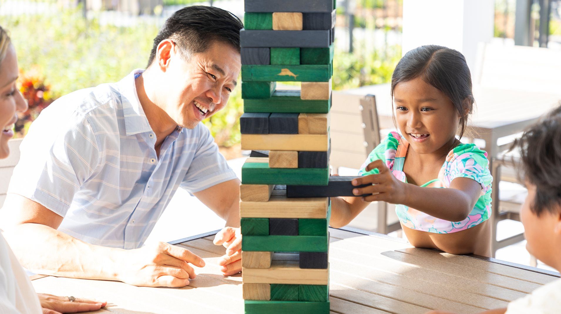 Father and daughter playing jenga