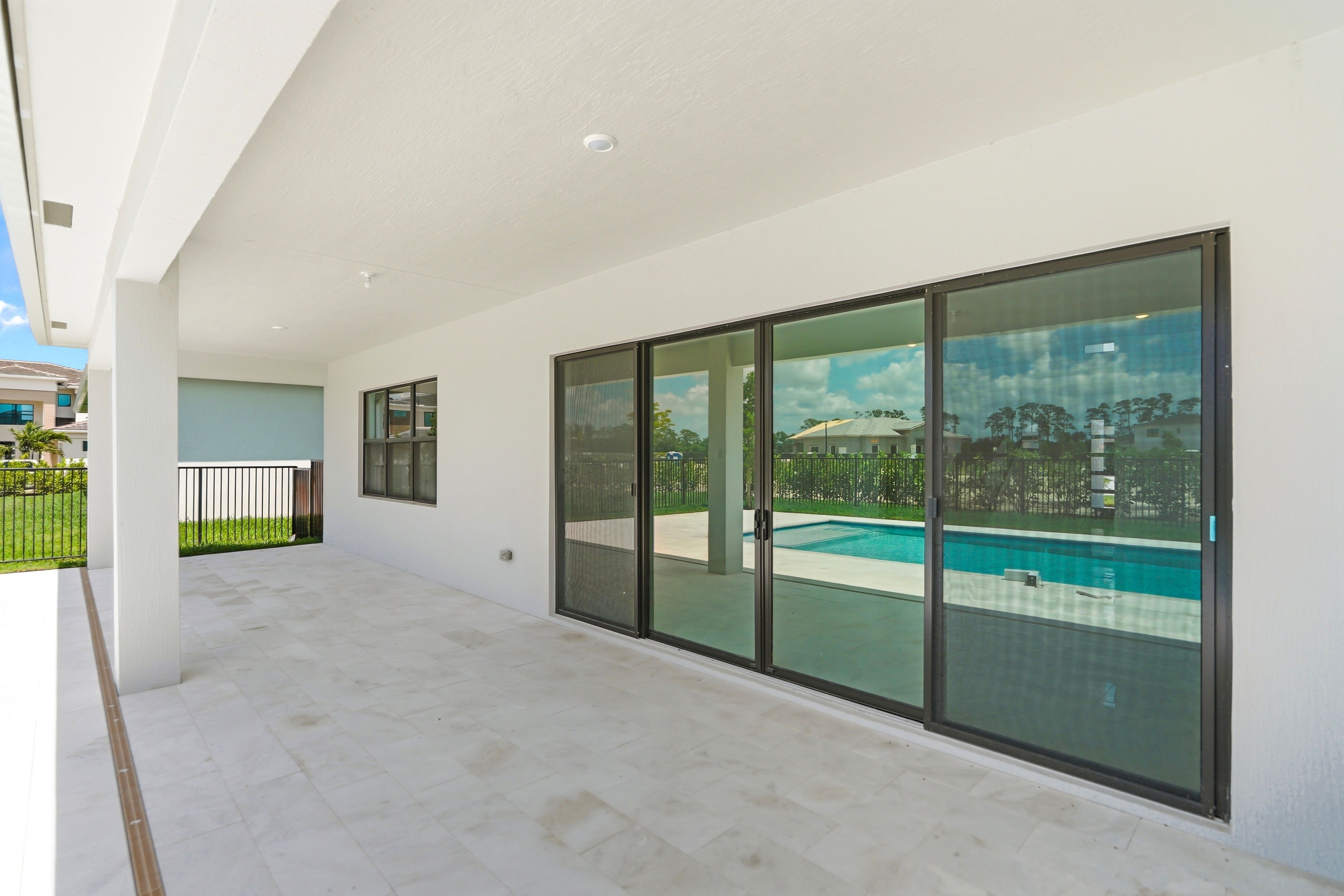 Kensington Whitmore Estates Versailles QMI H S123 Lanai 2of2 F1