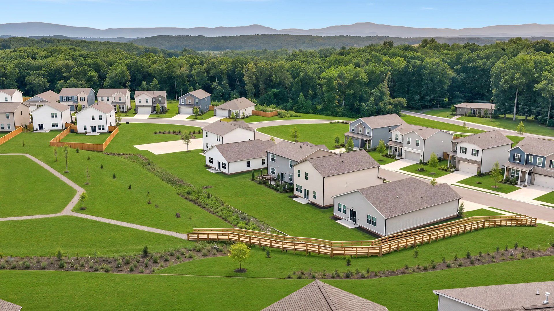 Aerial of a trail winding throughout homes