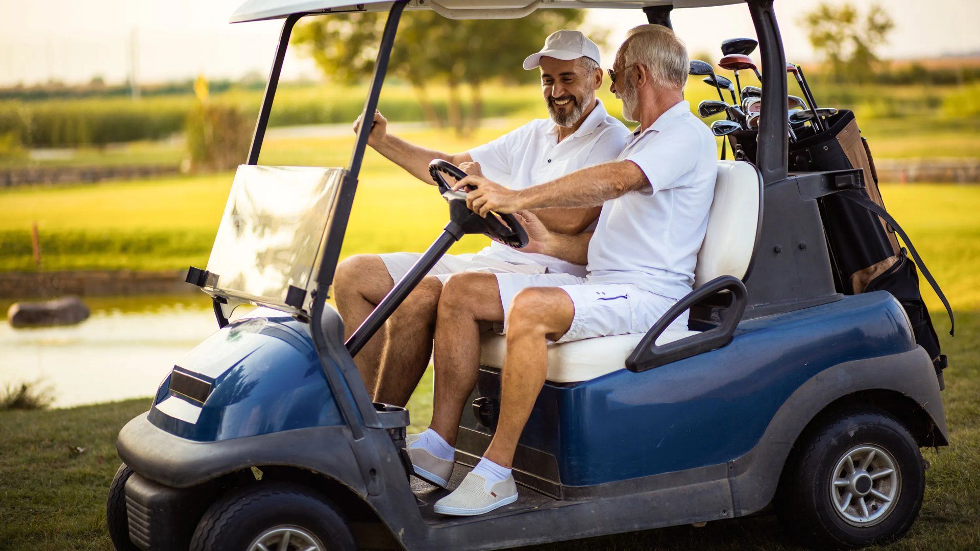Men riding golf cart