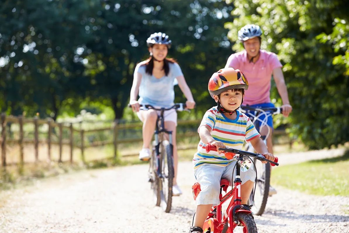 Family riding bikes together
