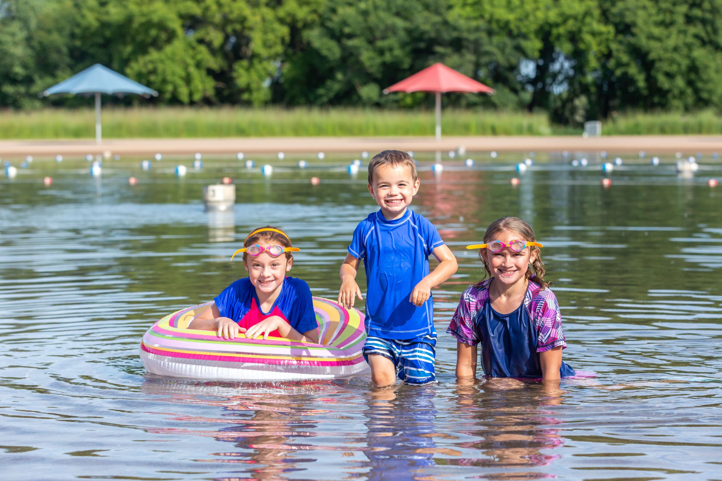 kids swimming in a lake