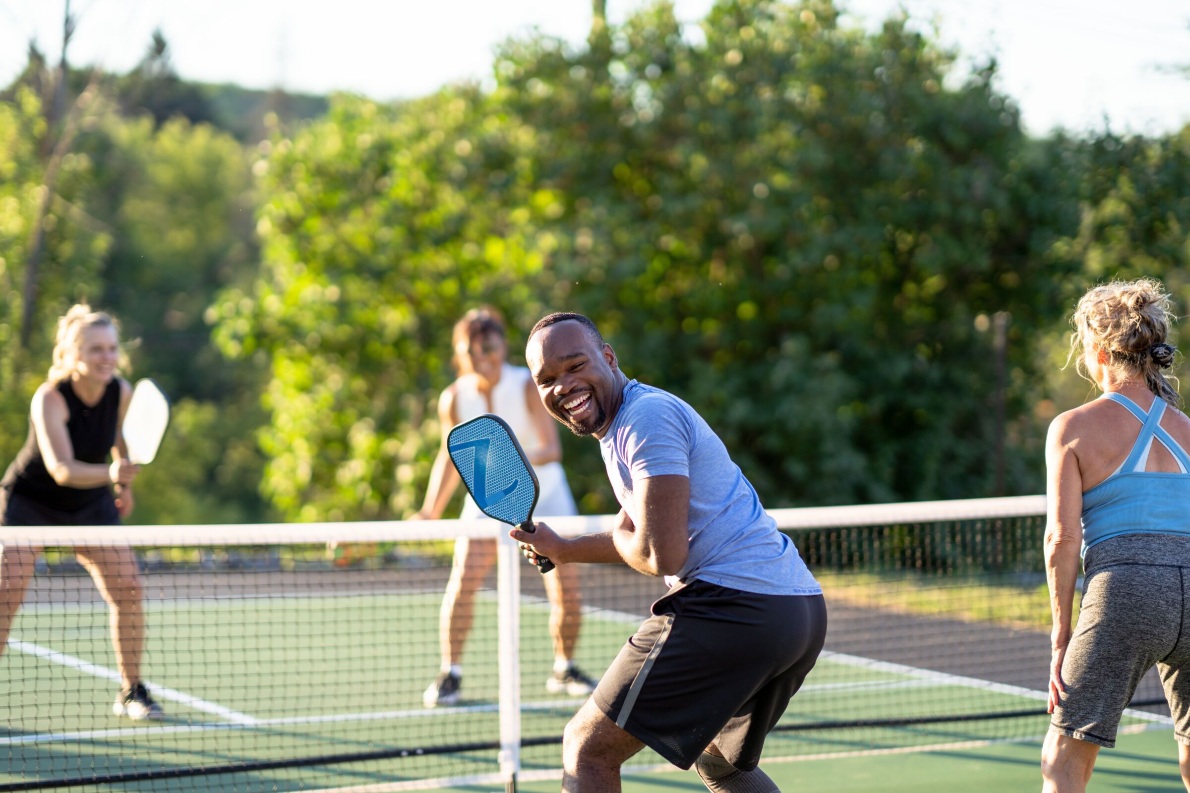 People Playing Pickleball on Court