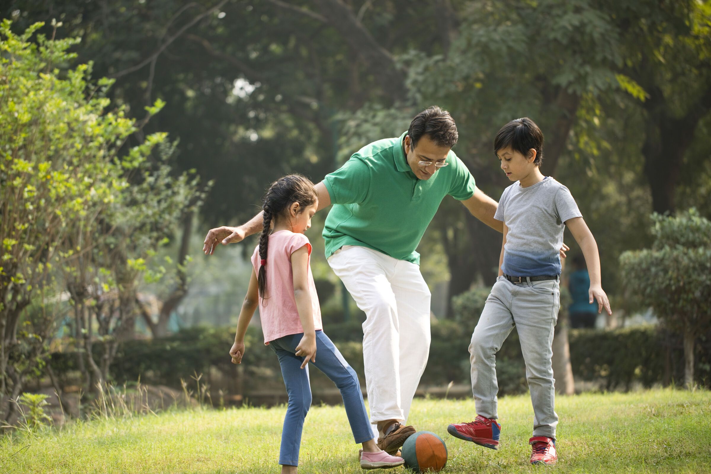 Family playing soccer