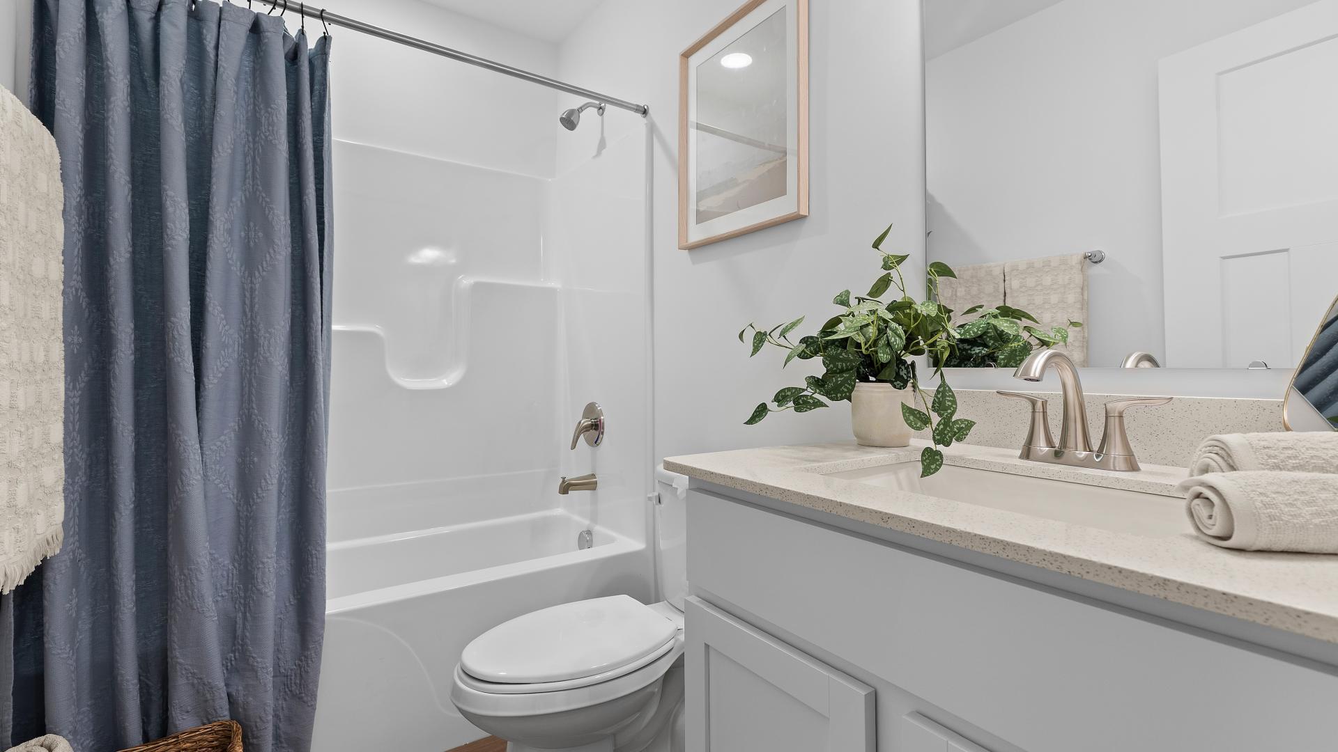The guest bathroom ensures friends and family have their own space for comfort during visits.