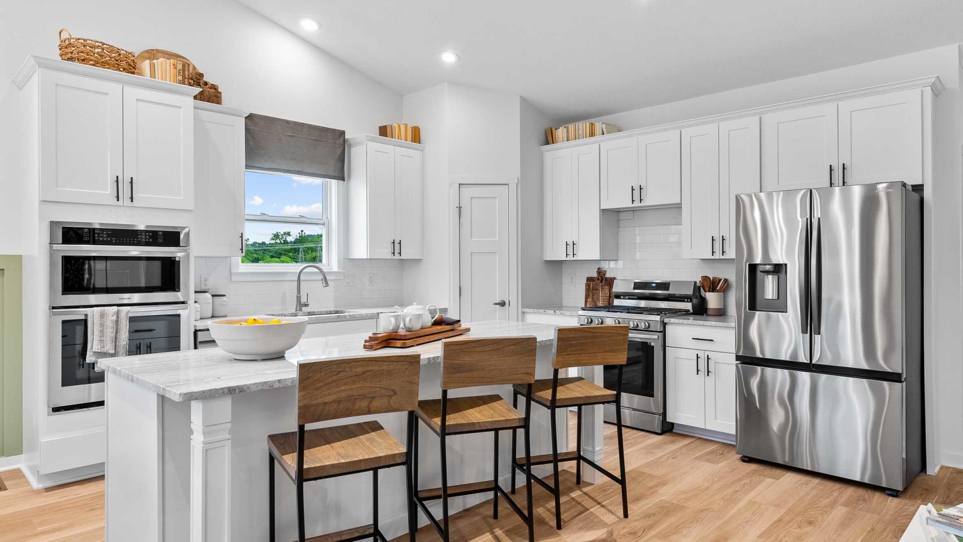 Your new kitchen has it all - Granite countertops, LVP flooring, and stainless steel appliances.