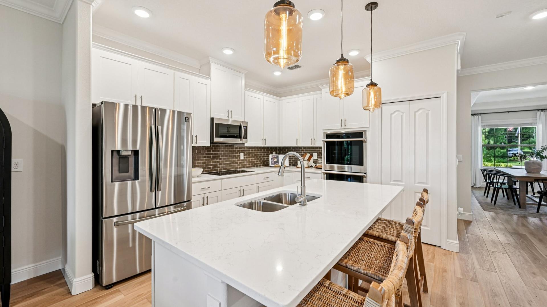 Your new kitchen has it all - Granite countertops, LVP flooring, and stainless steel appliances.