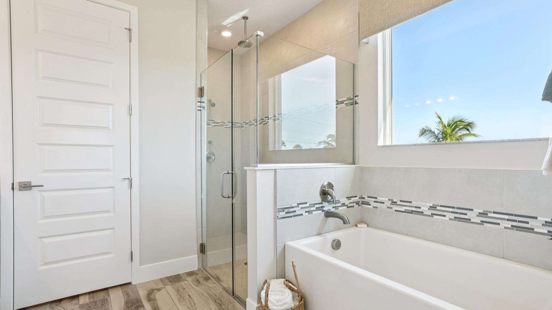 Dual vanities, walk-in tile surround showers and plenty of storage gives the master bath a spa like feel.