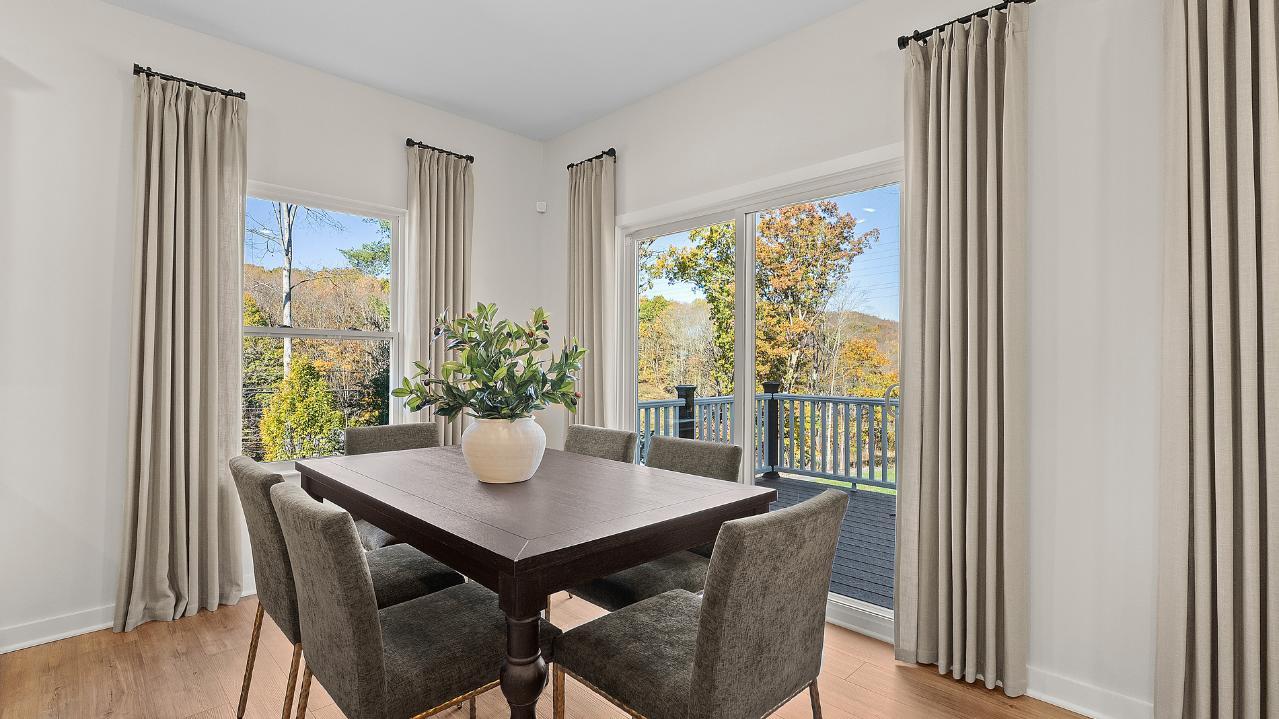 A patio door directly from your kitchen makes it easy to let your pup outside and enjoy the yard.