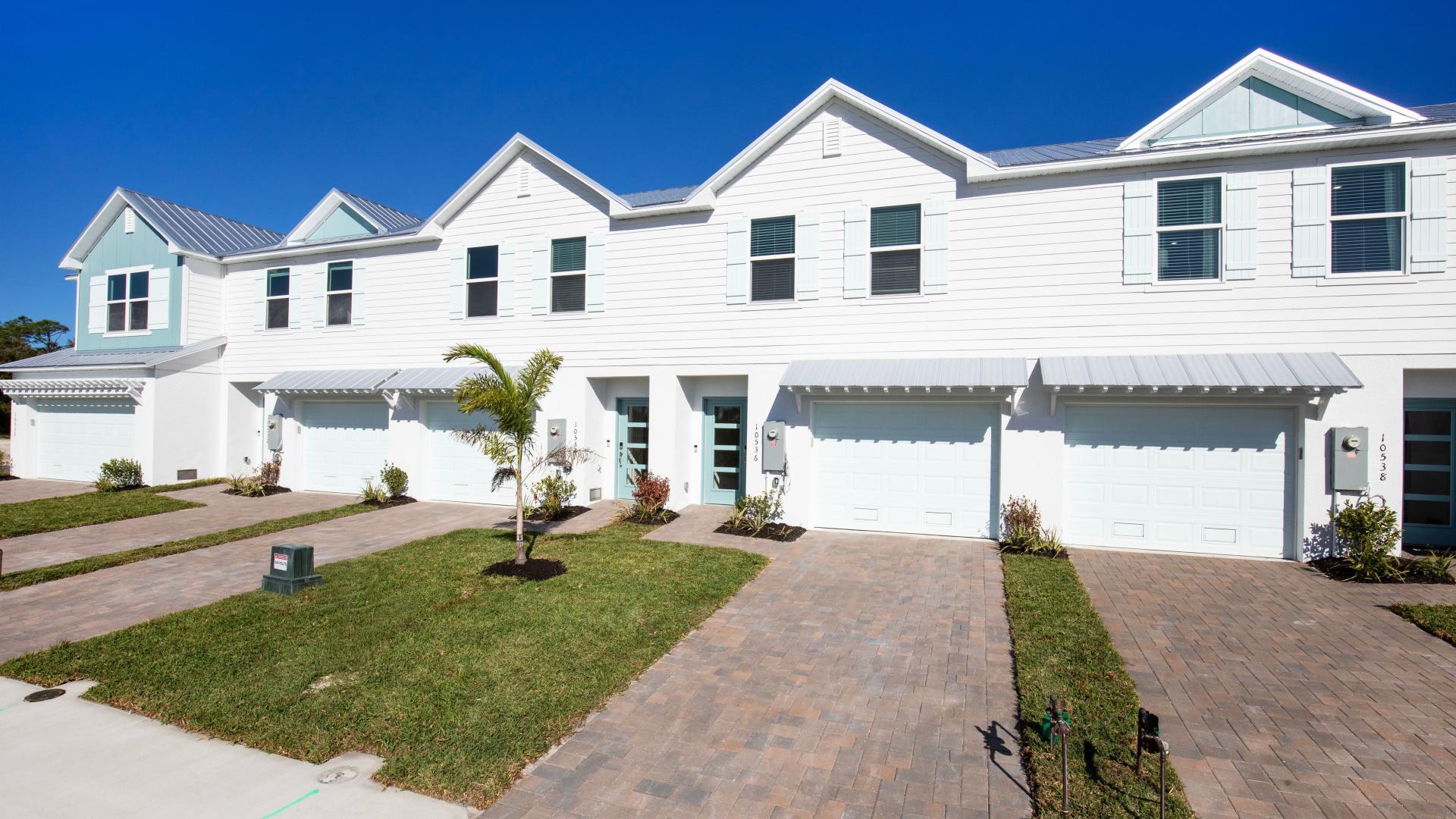 Bright, charming exteriors with metal roofs offer simple, low-maintenance living.