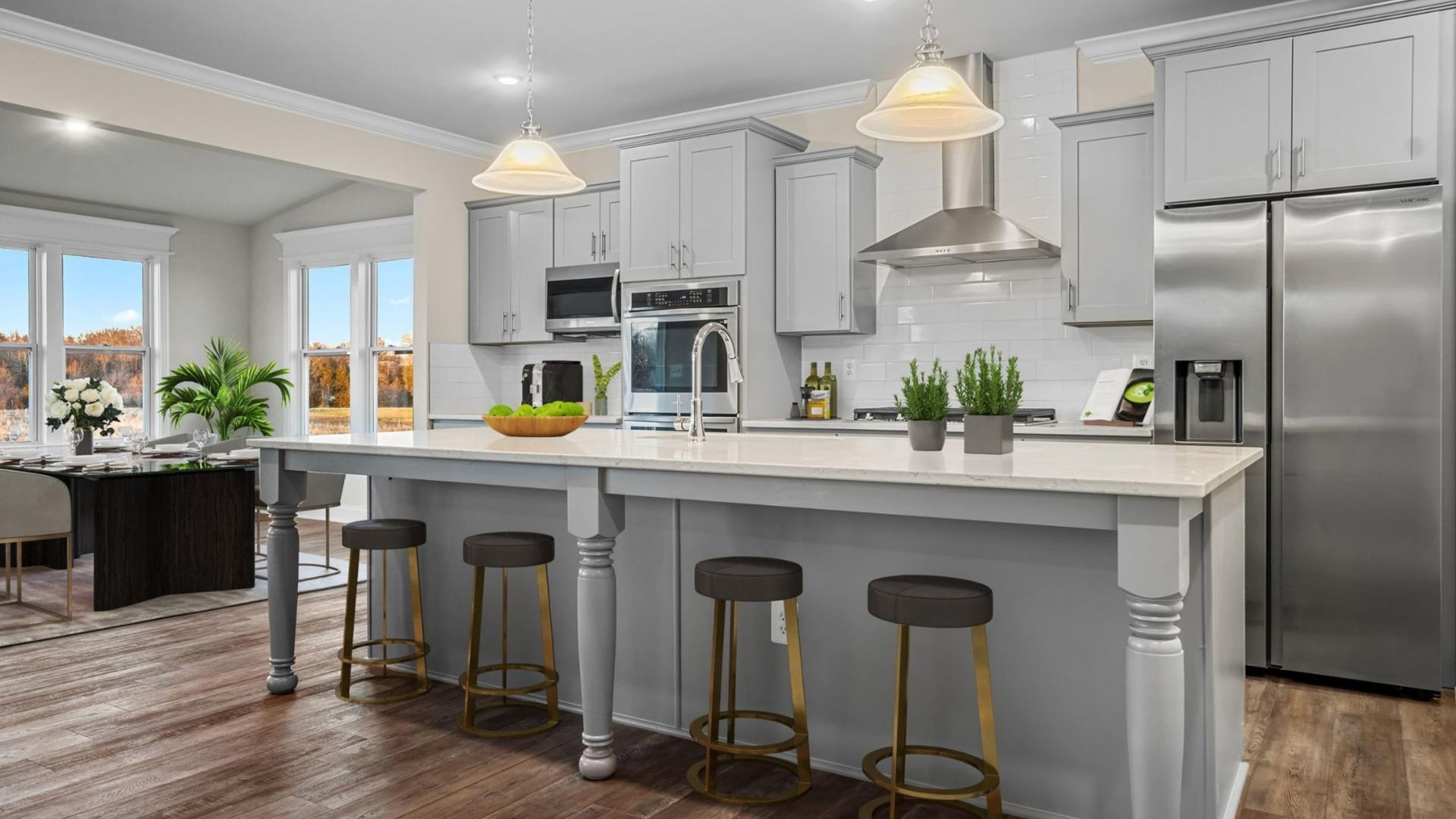 Chef’s kitchen w/ stainless steel built-in appliances, quartz countertops, oversized island &amp; more!