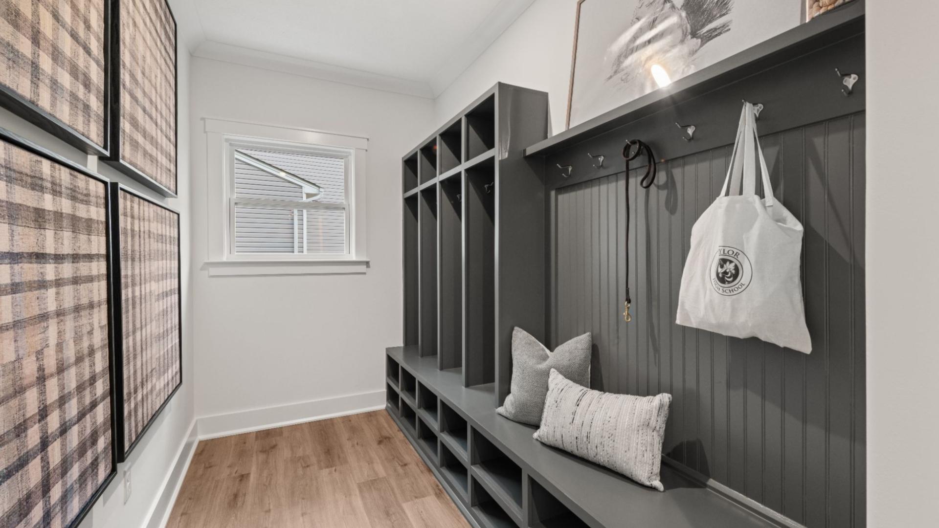 Keep the entrance from the garage tidy with built - in storage for coats, bags, and shoes,