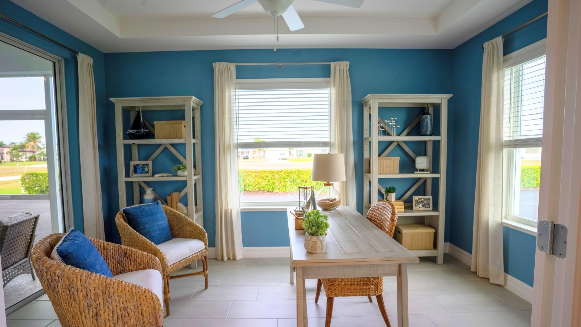 Versatile flex space offering indoor-outdoor living to the lanai.