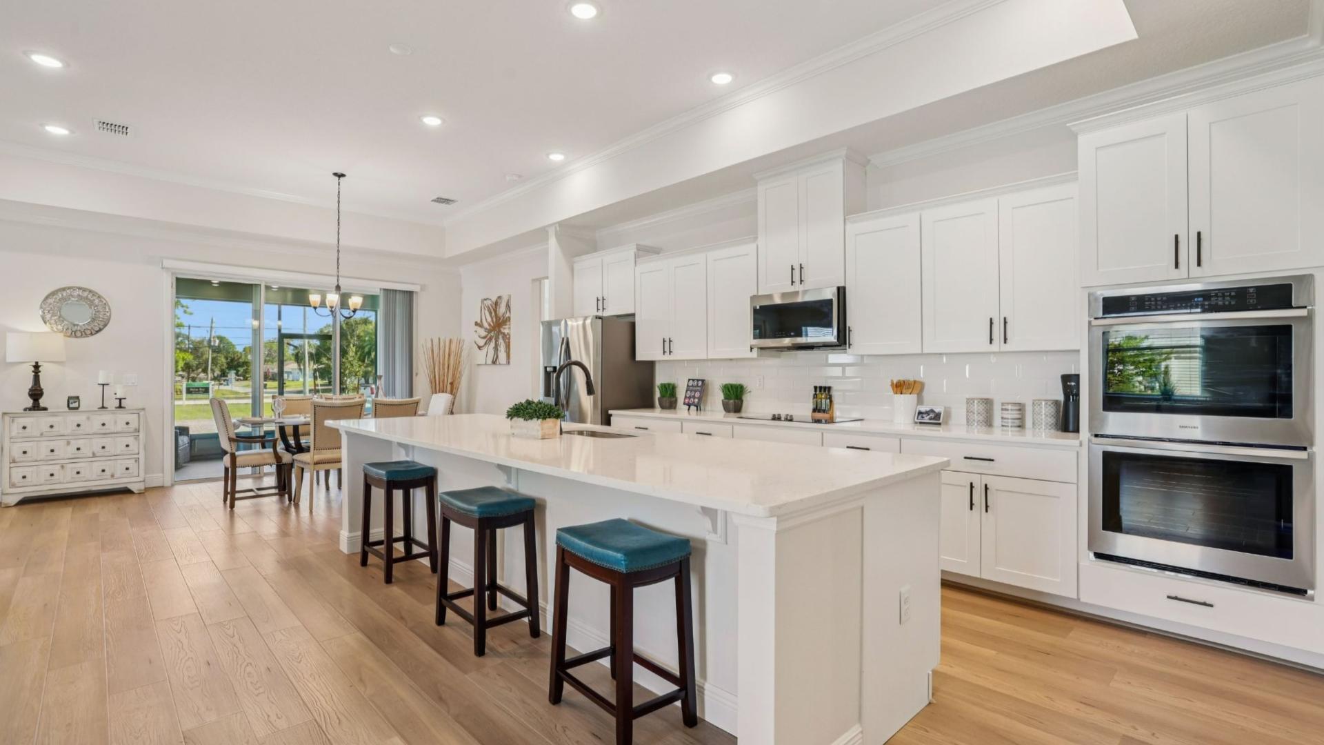 Impress with every detail – from large kitchen islands, up to 11’ ceilings, granite, and gleam.