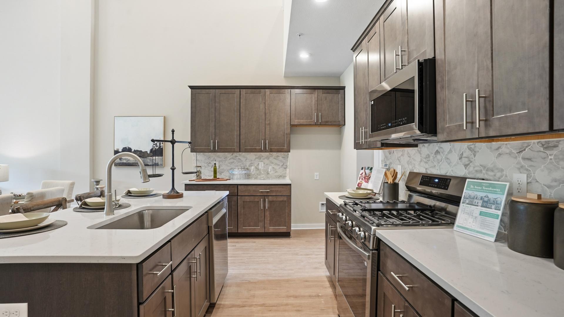 Your new kitchen has it all - Granite countertops, LVP flooring, and stainless steel appliances.