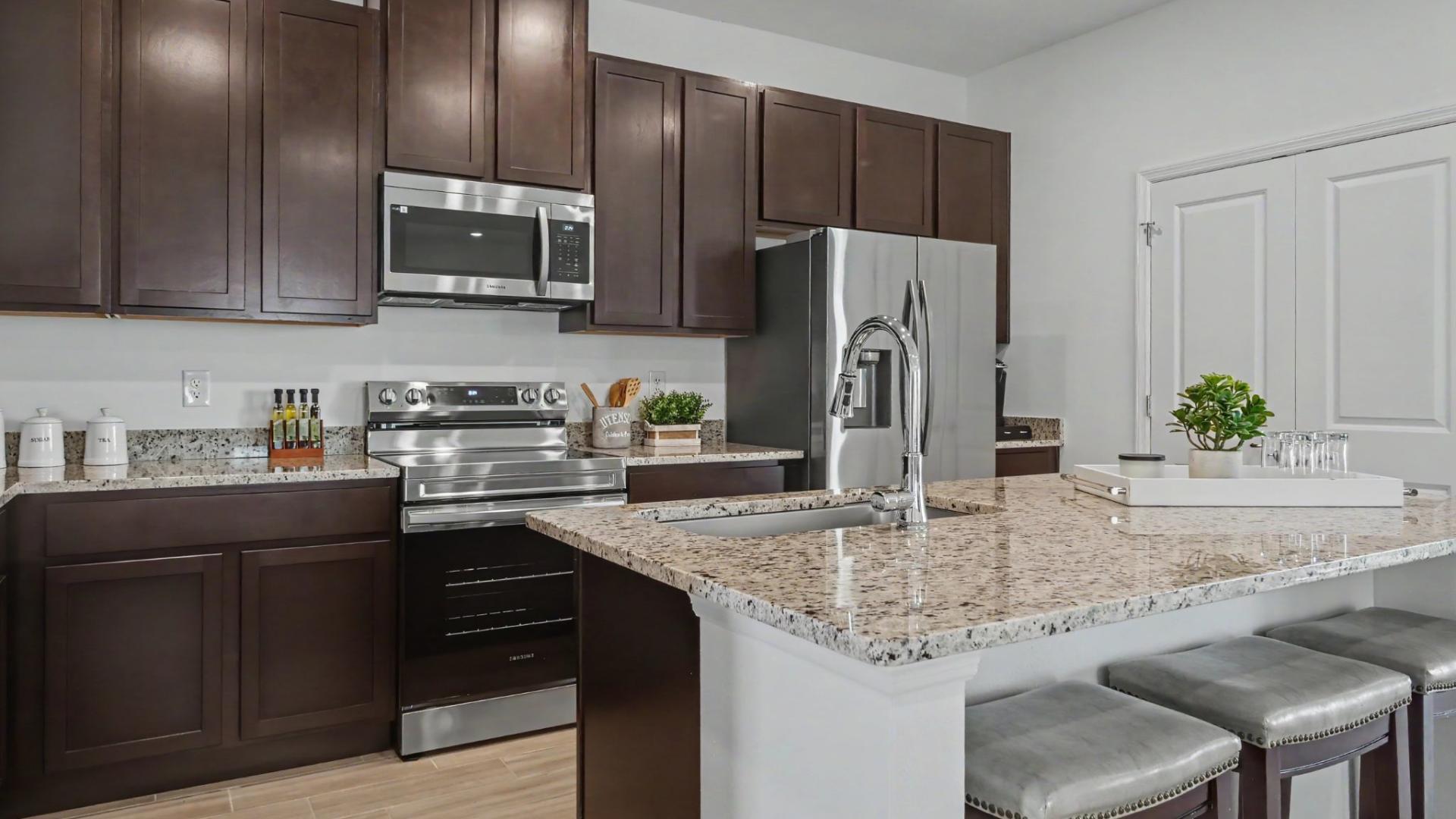 Homes feature granite countertops, stainless steel appliances, and LVP flooring.