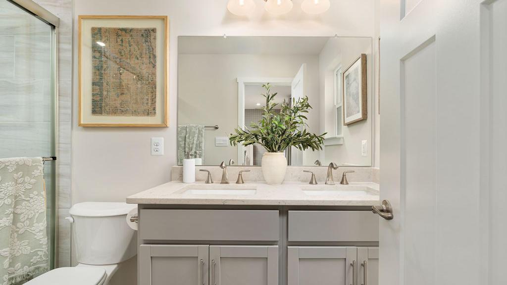 The St. Paul is perfect for roommates: 3.5 baths, dual vanities, and easy-to-maintain bathrooms.