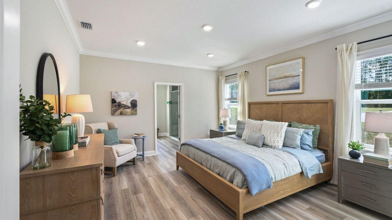Unwind in a spacious master bedroom suite designed for rest and relaxation.