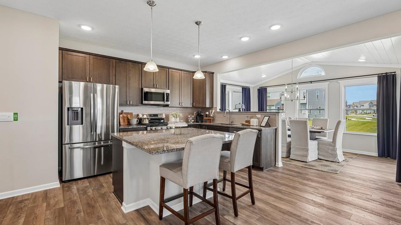Your new kitchen has it all - Granite countertops, LVP flooring, and stainless steel appliances.