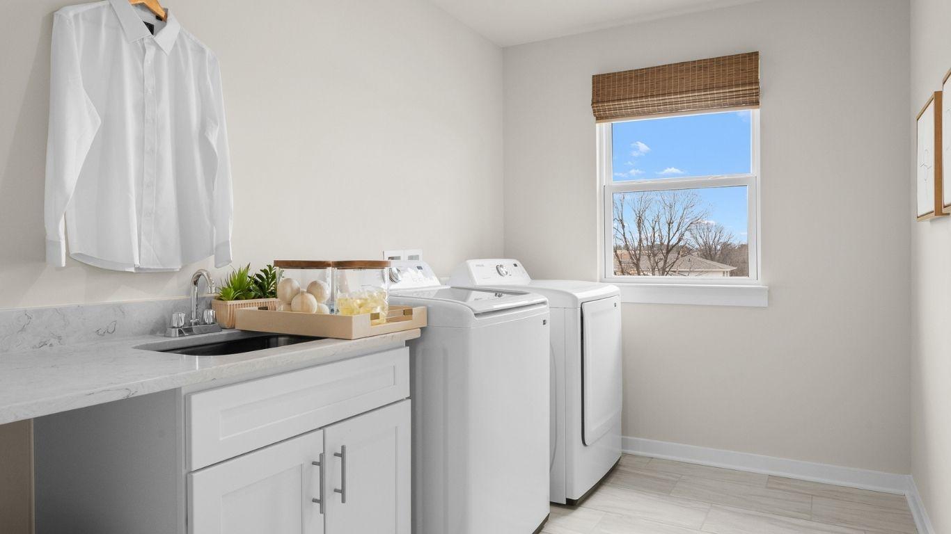 Dedicated laundry space makes chores easier. Join the List to receive home designs!