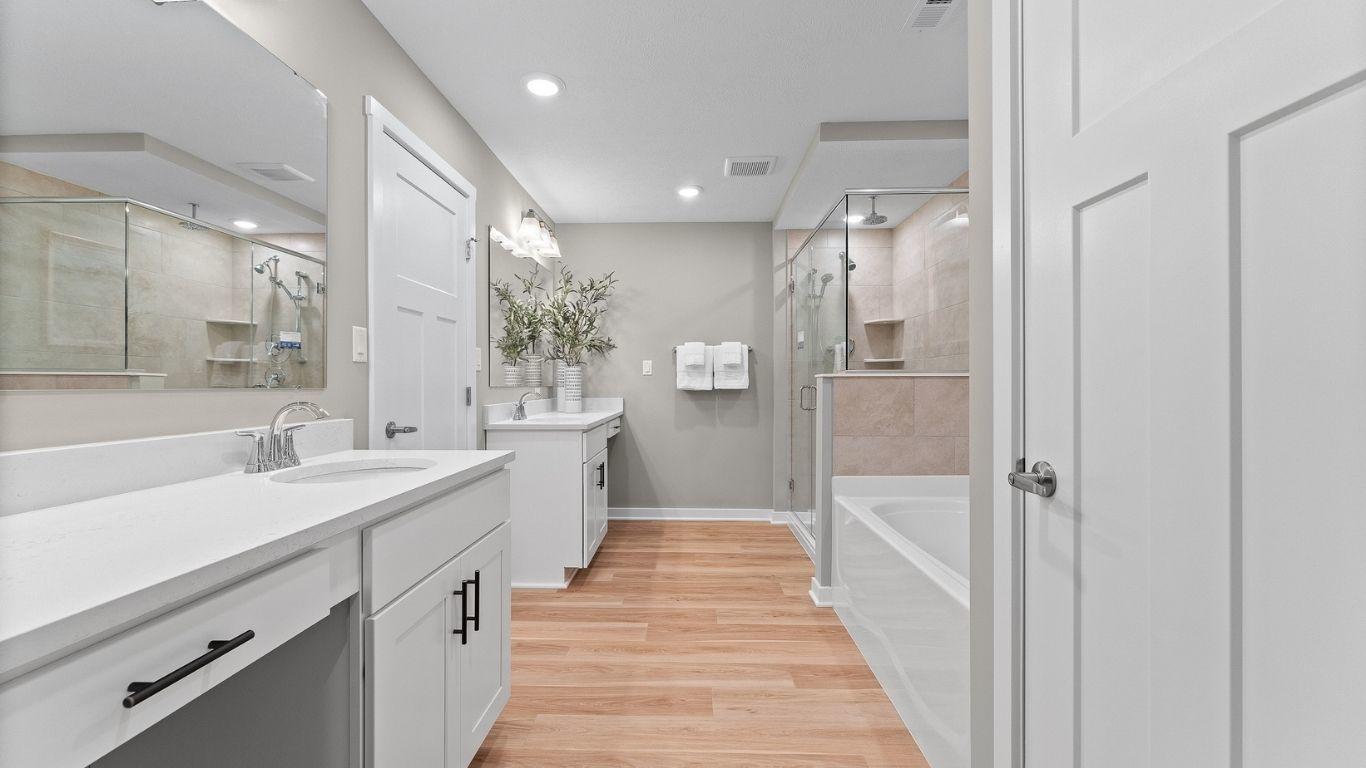 Personalize your master bath with frameless showers, split dual vanities, and rain shower head.