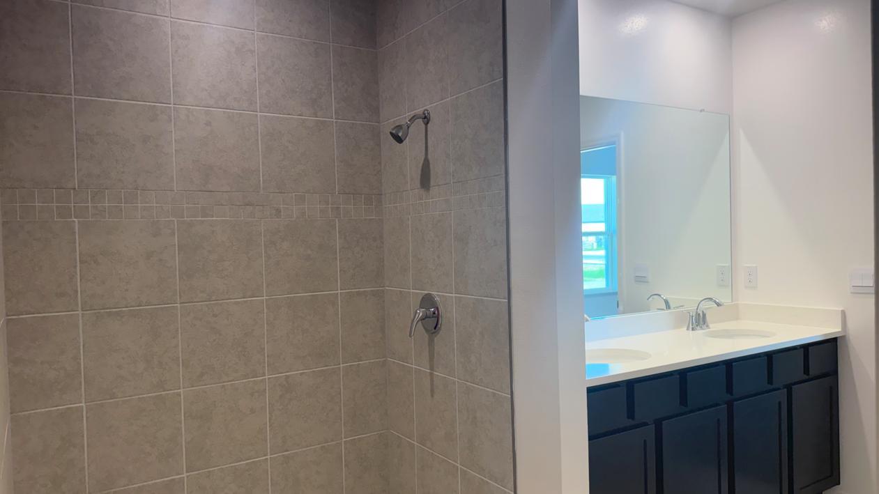 Primary Bathroom w/ Quartz Countertops and floor to ceiling