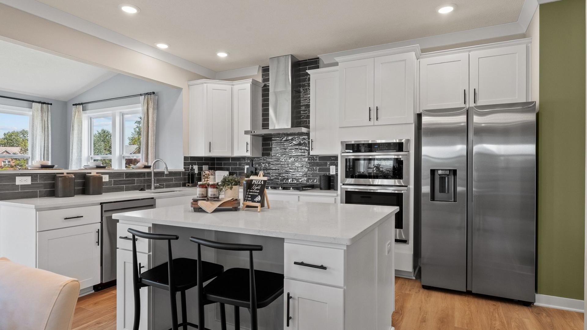 Granite countertops, LVP flooring, kitchen island, and stainless steel appliances included!