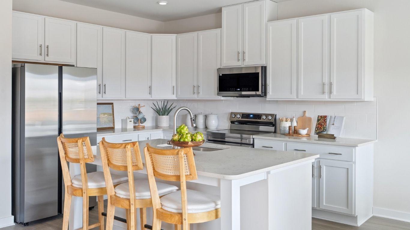 Your new kitchen includes an island, pantry, granite countertops, and LVP flooring.