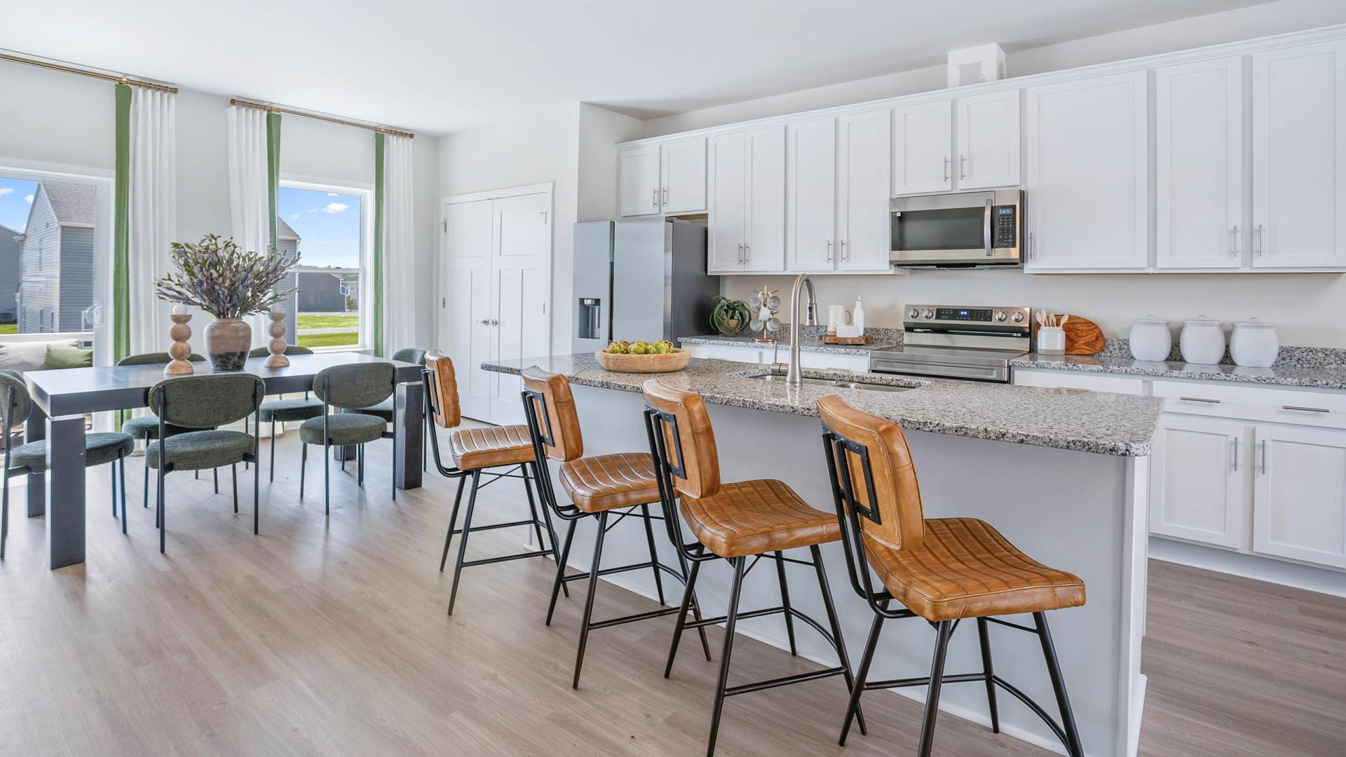 Your new kitchen has it all - Granite countertops, LVP flooring, and stainless steel appliances.