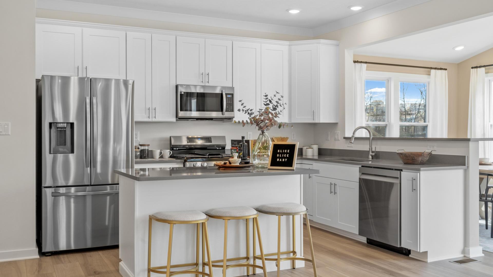 Granite countertops, stainless steel appliances, 9’ ceilings, LVP, and kitchen Island all included.