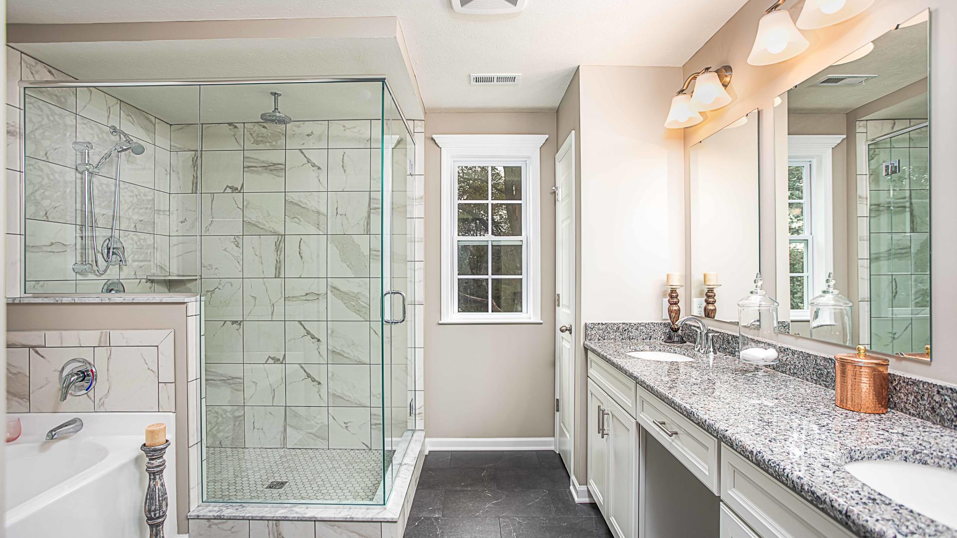 Dual vanities, frameless walk-in showers, and plenty of storage space in your master bath.