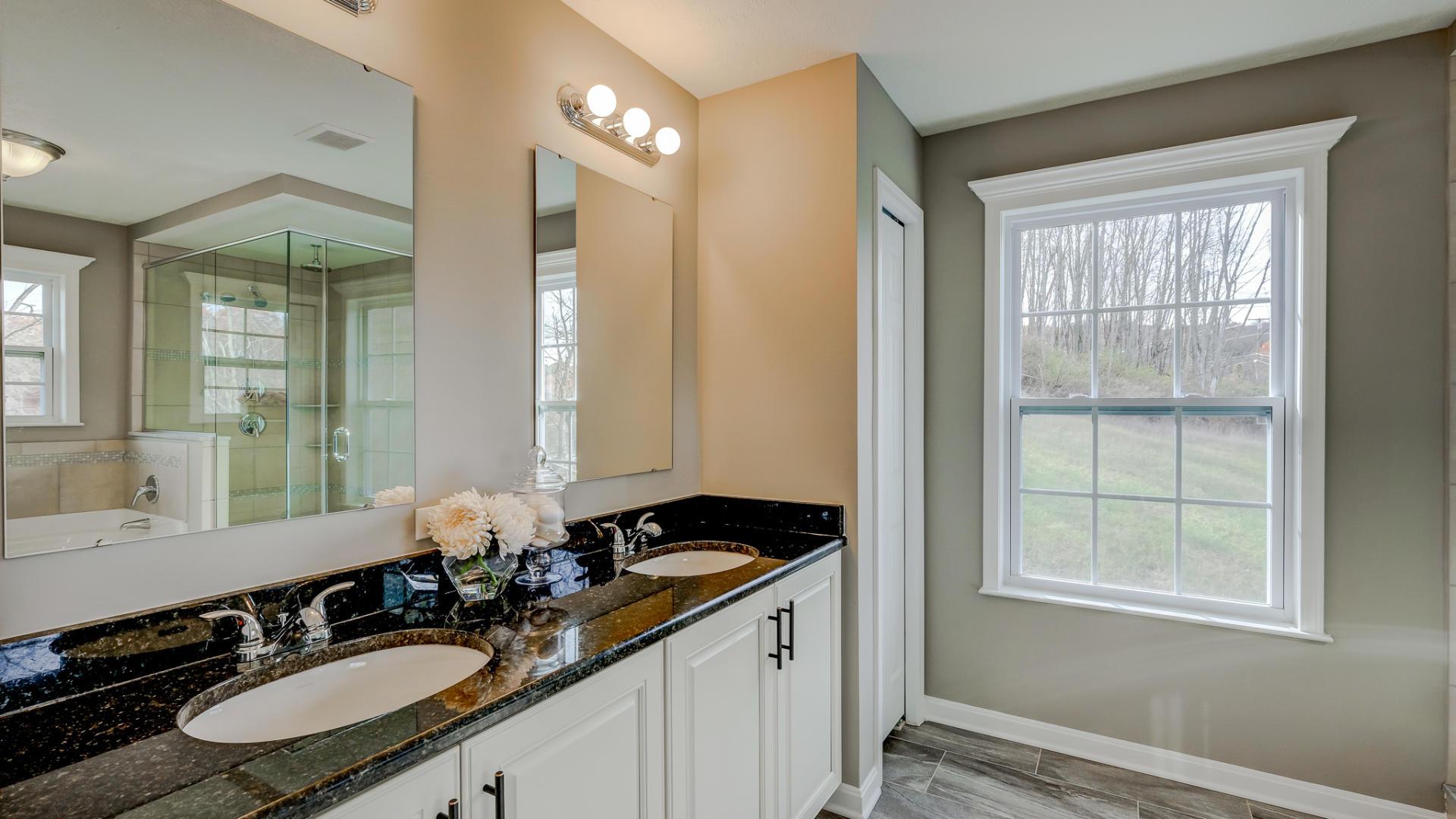 Bathrooms with double sinks, plenty of storage, and a modern, stylish design.