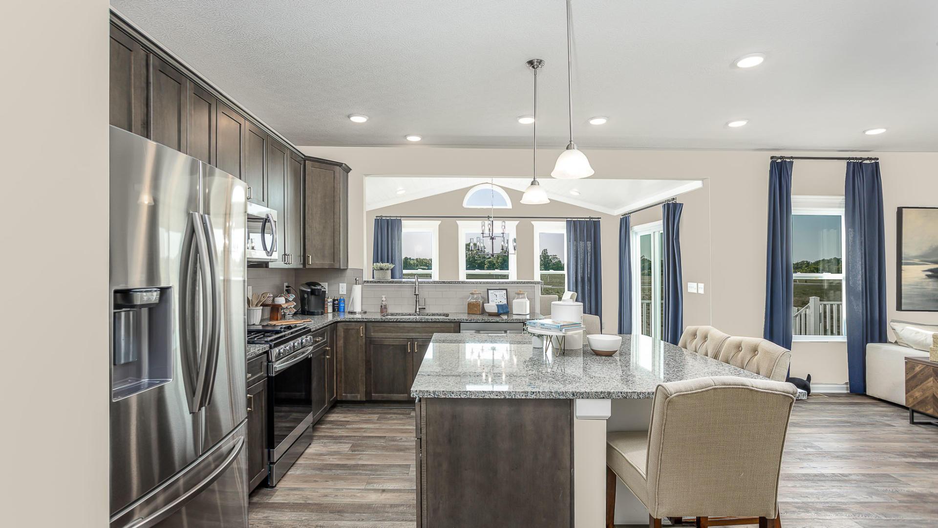 Your new kitchen has it all - Granite countertops, LVP flooring, and stainless steel appliances.