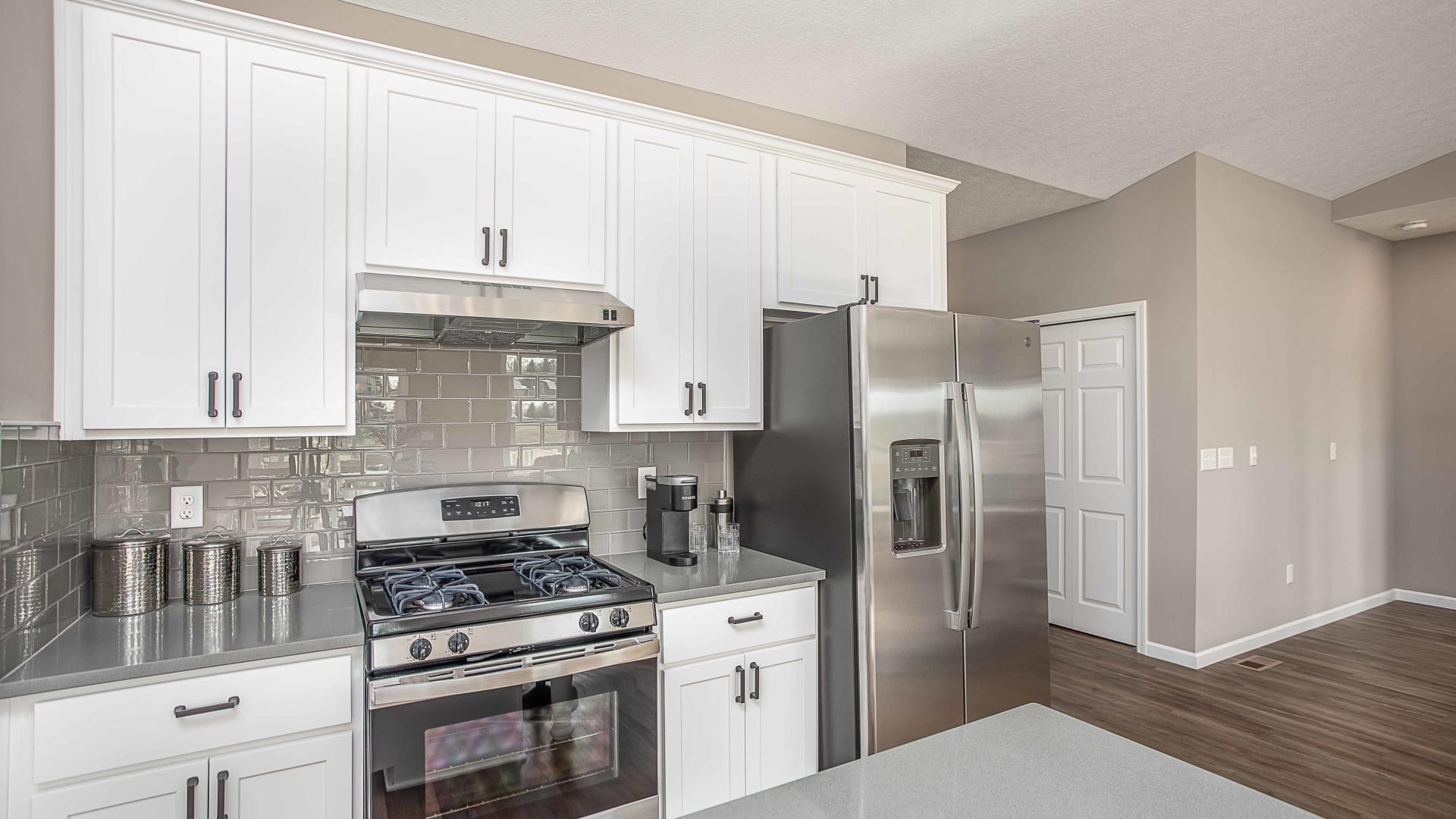 Your new kitchen will feature stainless steel appliances and a spacious island for cooking and entertaining.