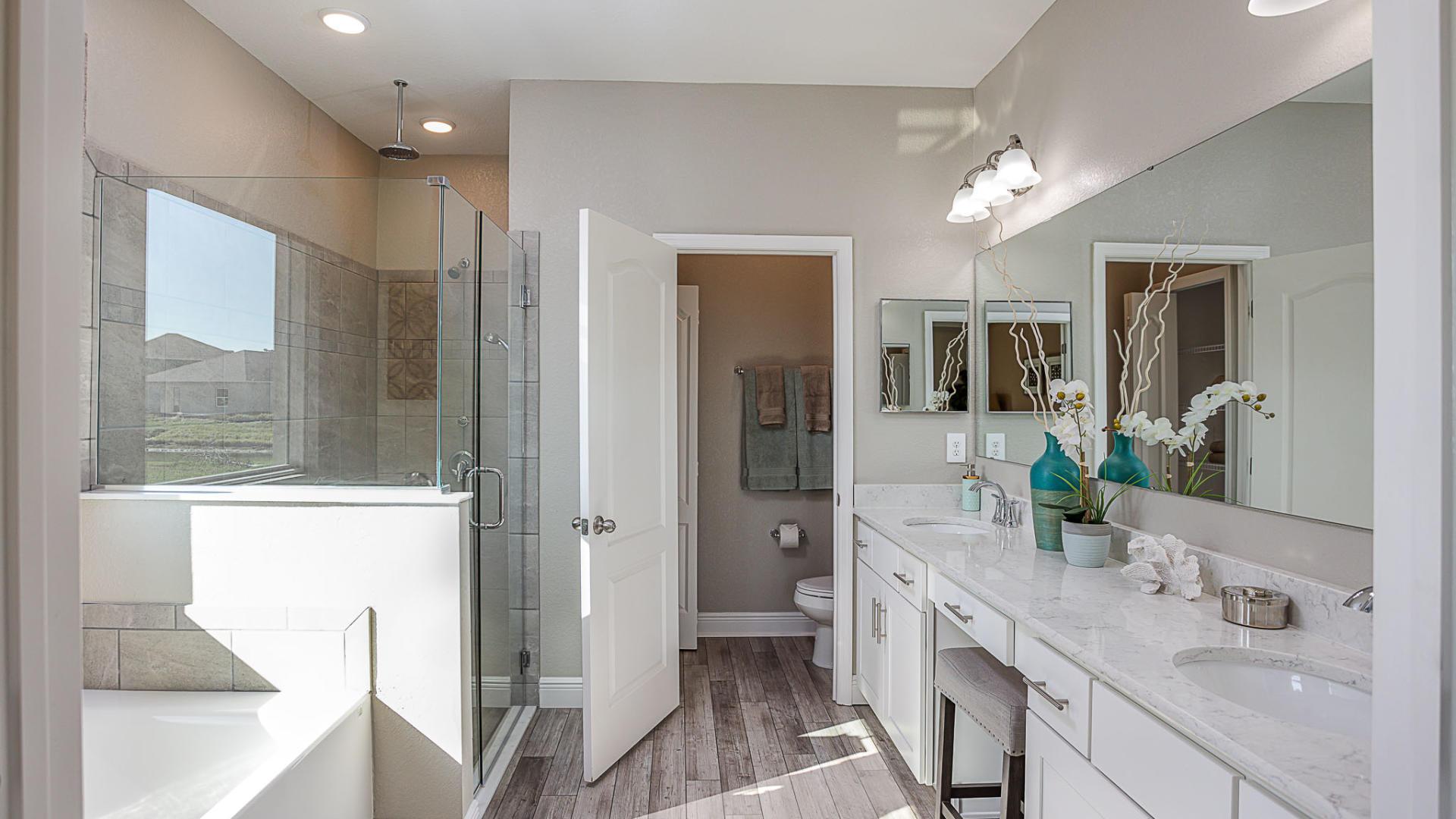 Dual vanities, walk-in tile surround showers, soaking tubs, and plenty of storage gives the master bath a spa like feel.