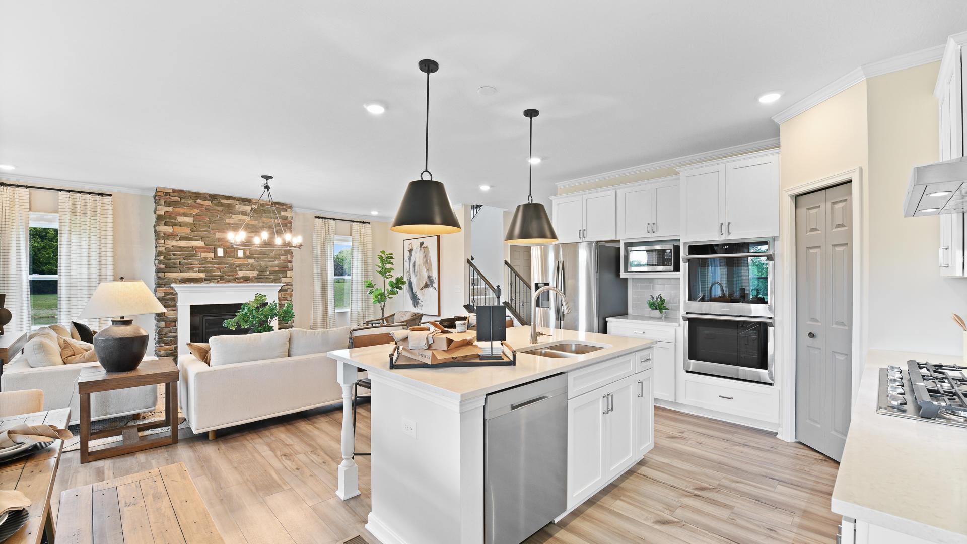 Your new kitchen has it all - Granite countertops, LVP flooring, and stainless steel appliances.
