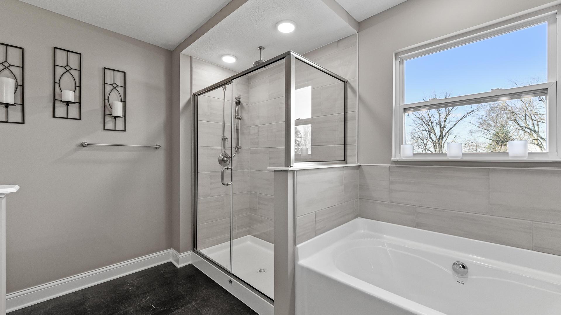 ... and floor to ceiling tile for a spa-like experience.