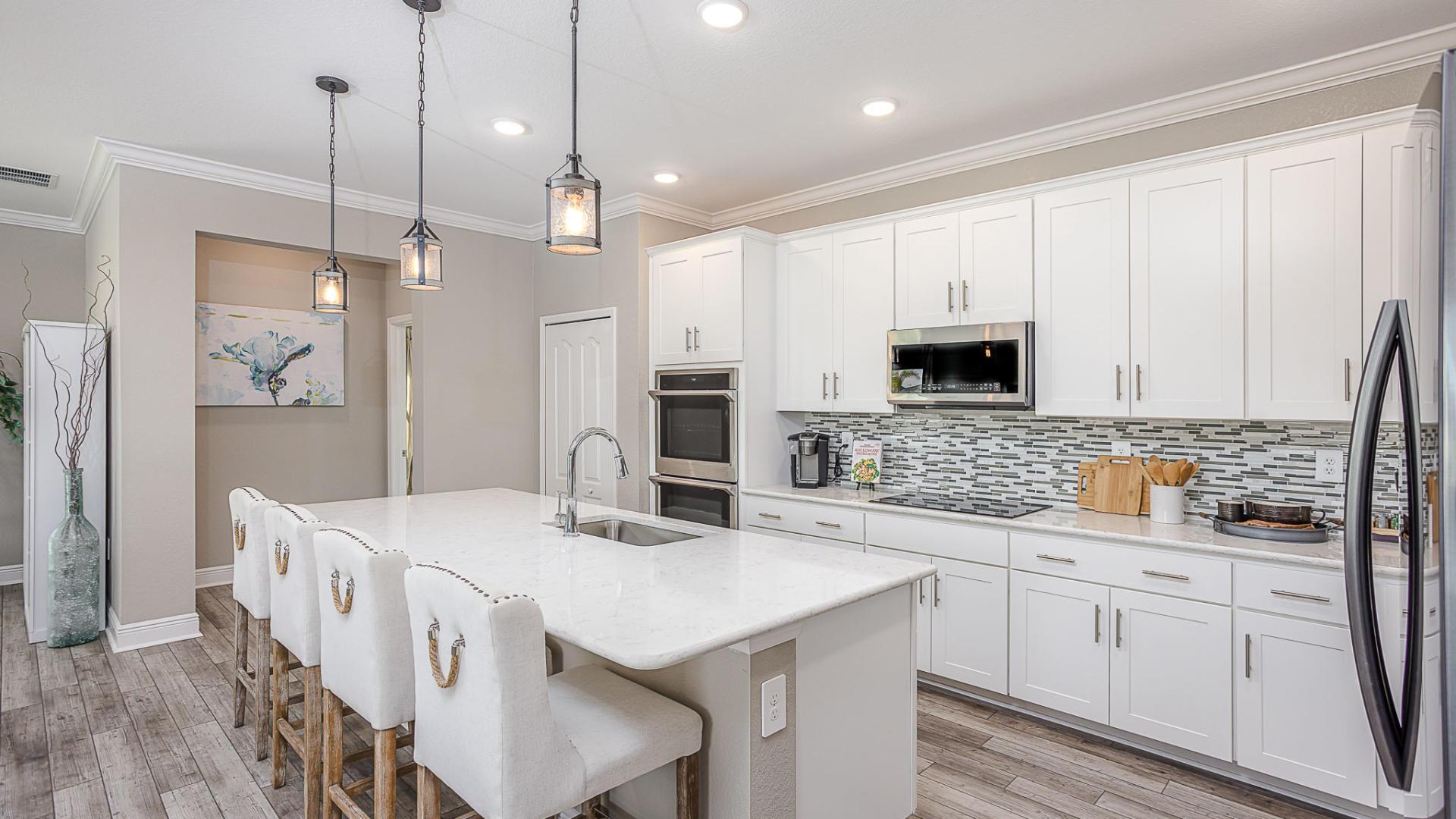 Your new kitchen has it all - Granite countertops, LVP flooring, and stainless steel appliances.