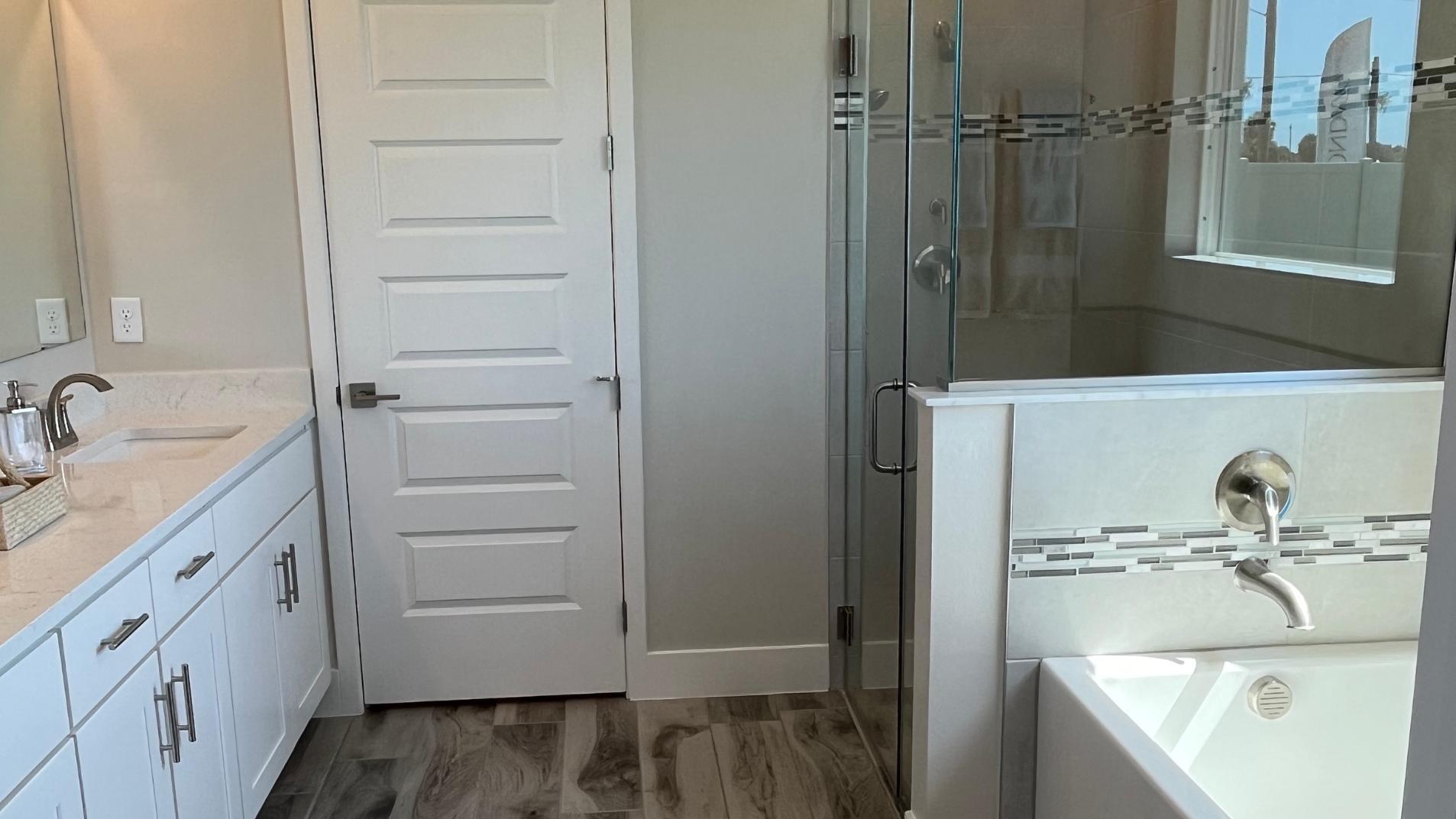 Dual vanities, walk-in tile surround showers and plenty of storage gives the master bath a spa like feel.
