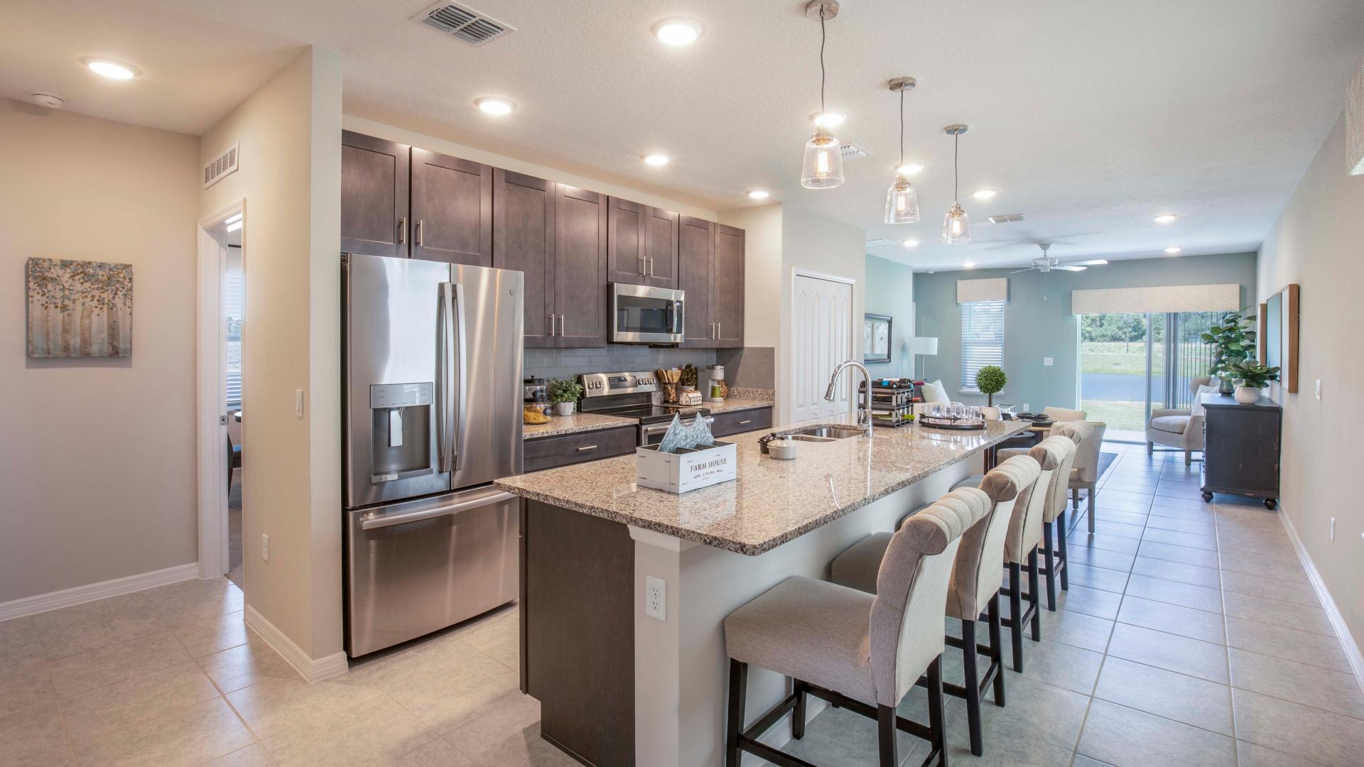 Your new kitchen has it all - Granite countertops, LVP flooring, and stainless steel appliances.