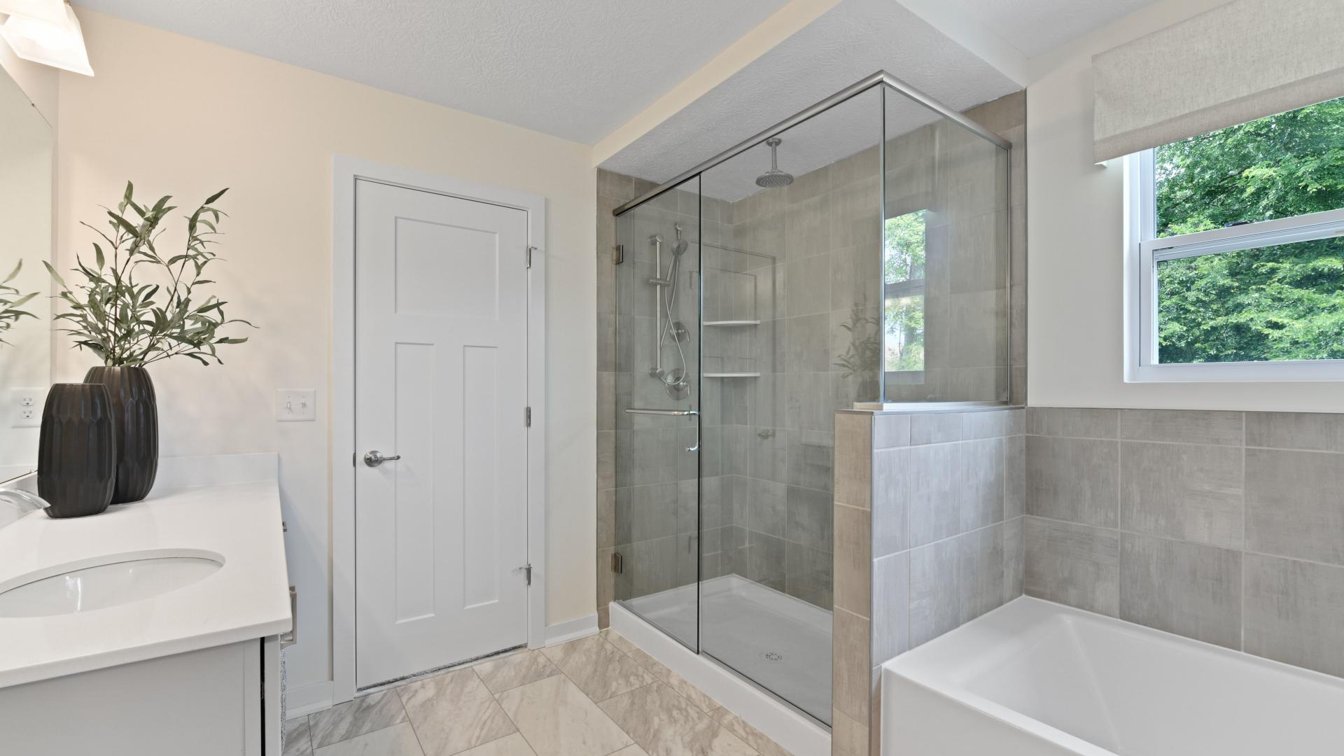Dual vanities, frameless walk-in showers, and plenty of storage space in your master bath.
