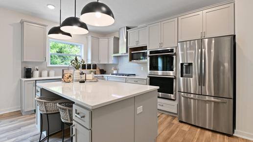 Your new kitchen has it all - Granite countertops, LVP flooring, and stainless steel appliances.
