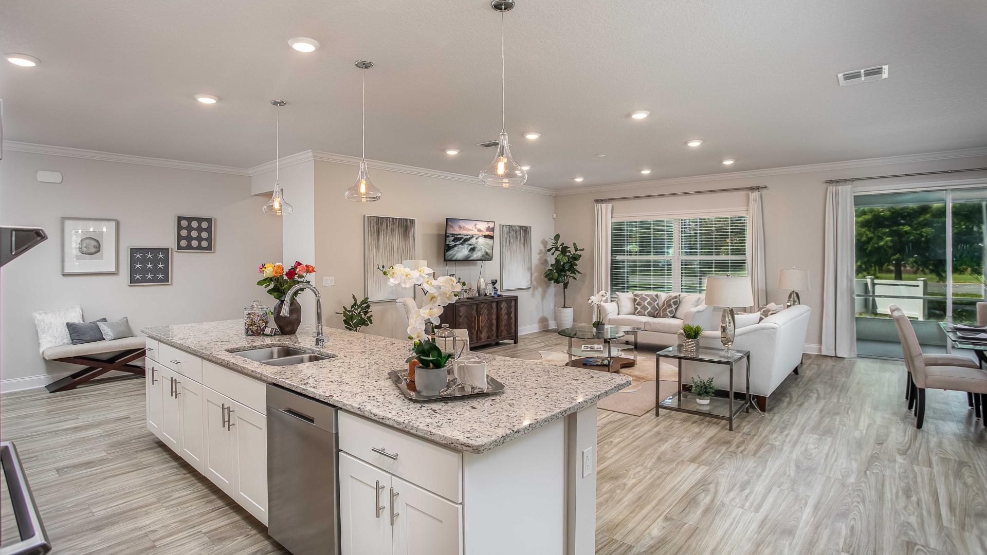 Your living room flows seamlessly from the kitchen, making it where everyone wants to gather.