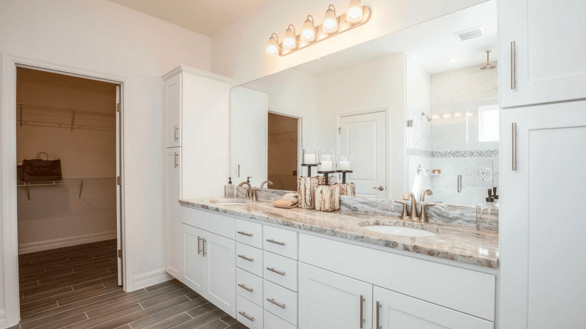 Features like a double-sink vanity elevate your master suite.