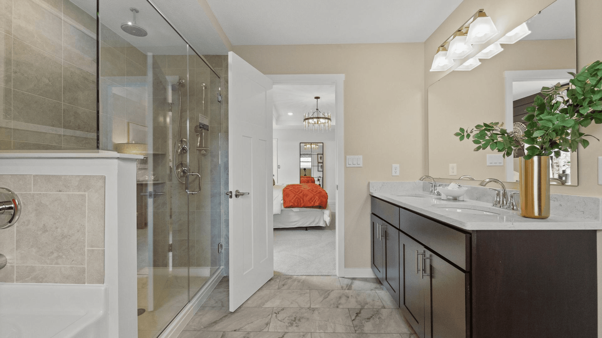 Dual vanities, frameless walk-in showers, and plenty of storage space in your master bath.