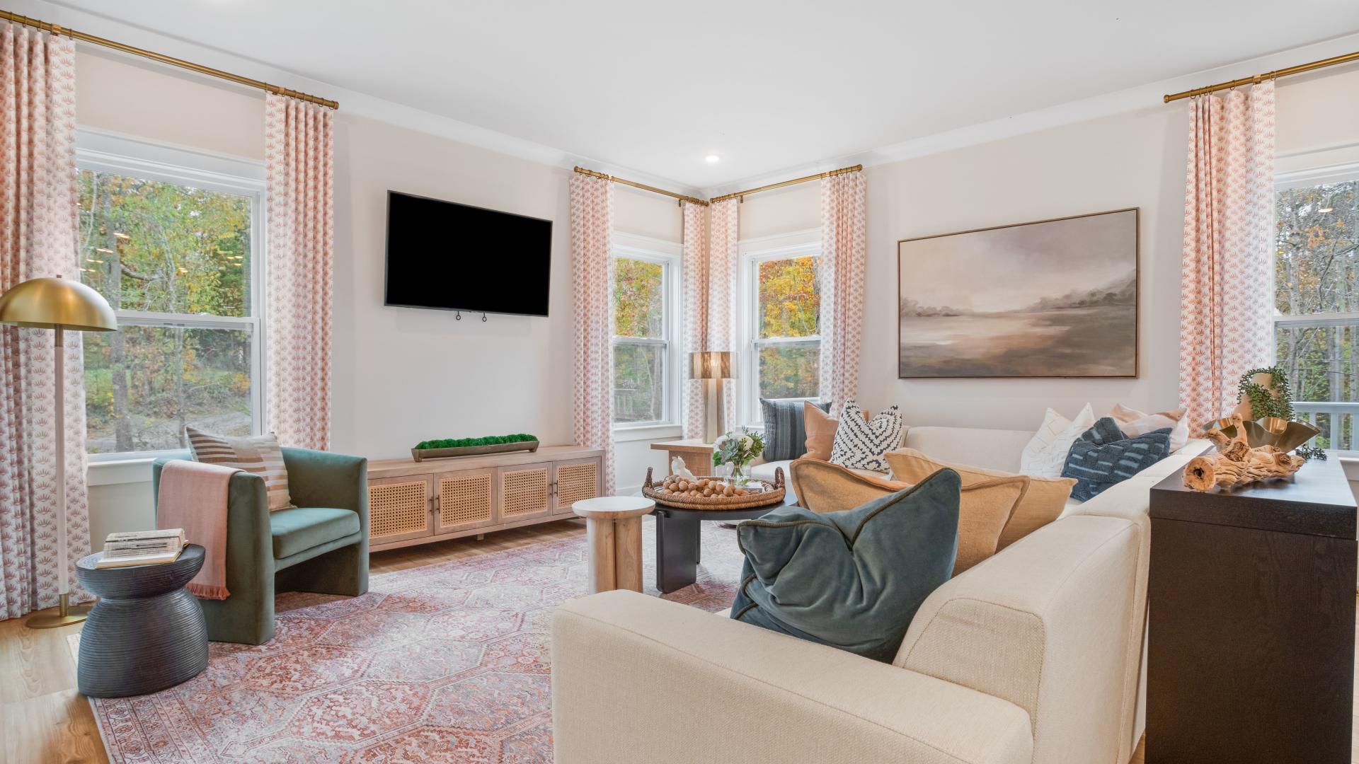 Easily host game night with friends and family with the seamless flow of the family room, kitchen, and sunroom.