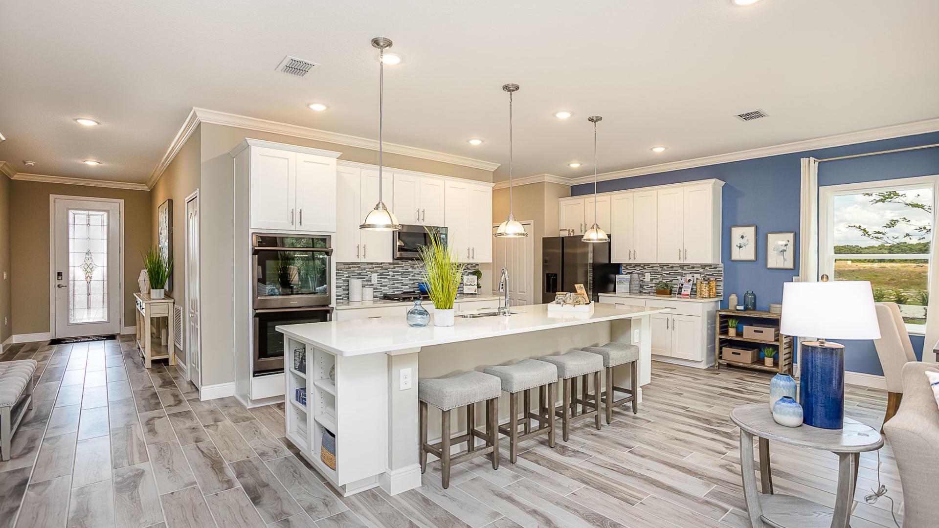 LVP flooring, stainless steel appliances, islands with storage space, and more.