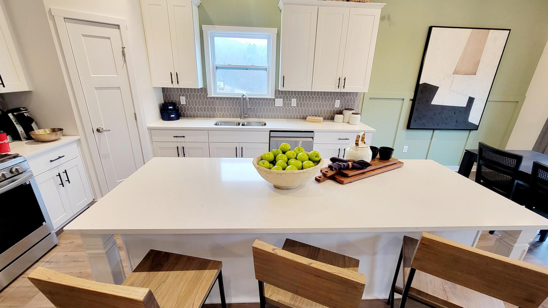 Your new kitchen has it all - Granite countertops, LVP flooring, and stainless steel appliances.