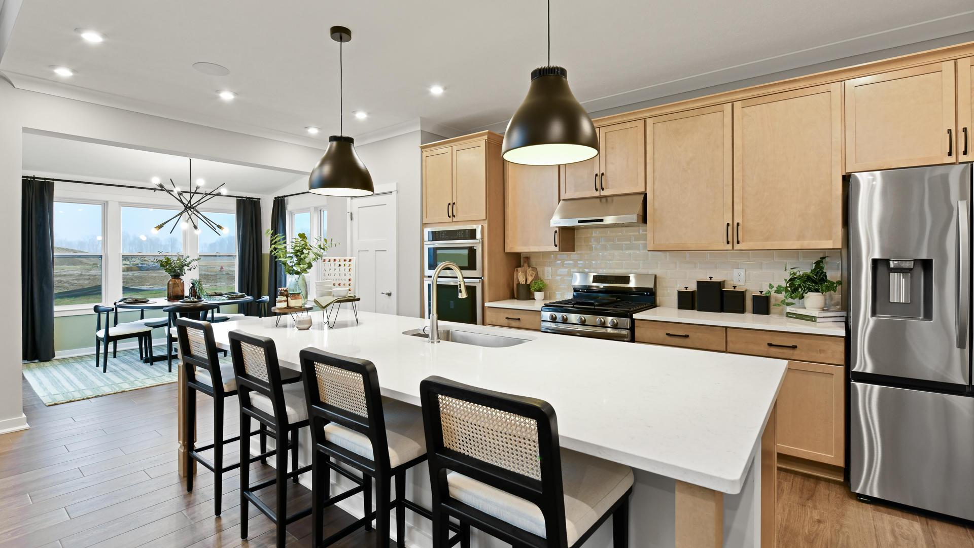 Choose a Chef's Kitchen complete with quartz countertops and spacious island, perfect for hosting.