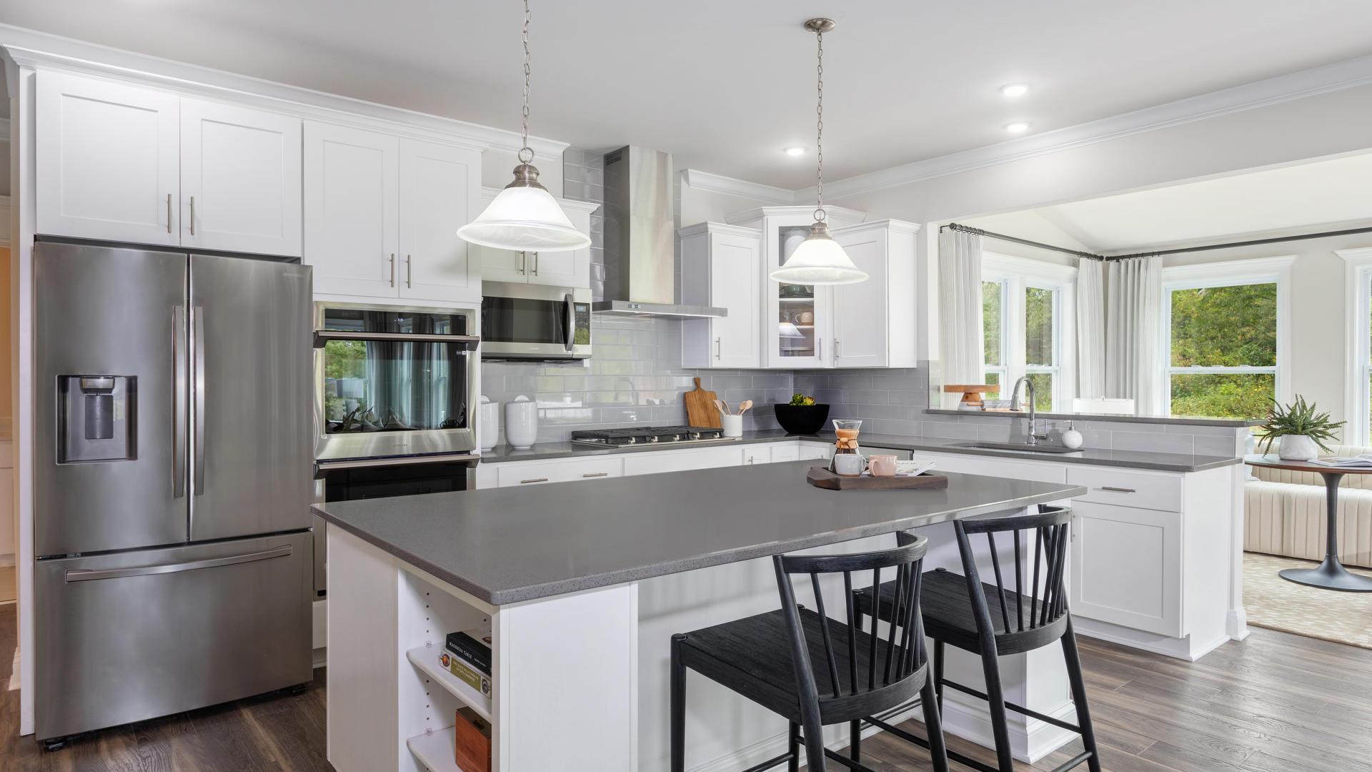 Your new kitchen has it all - Granite countertops, LVP flooring, and stainless steel appliances.